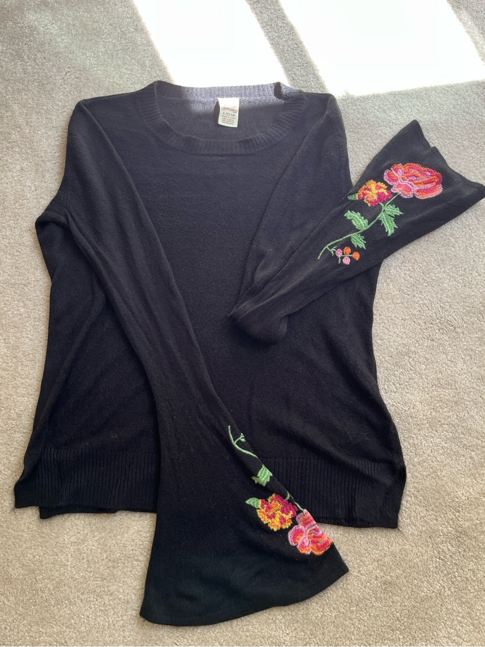 Black sweater with embroidered bell sleeves
